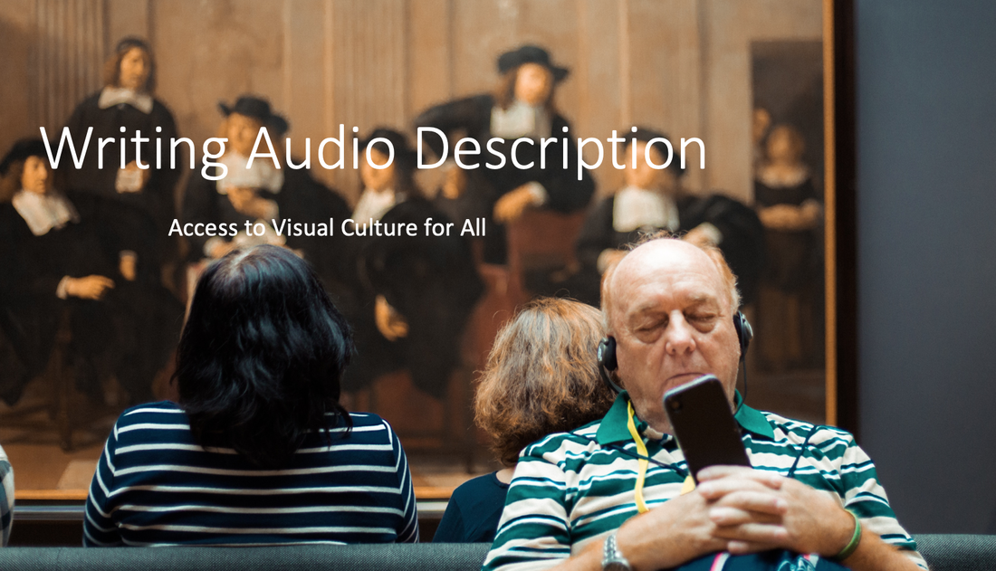 A man in a museum listening to an audio tour on headphones.